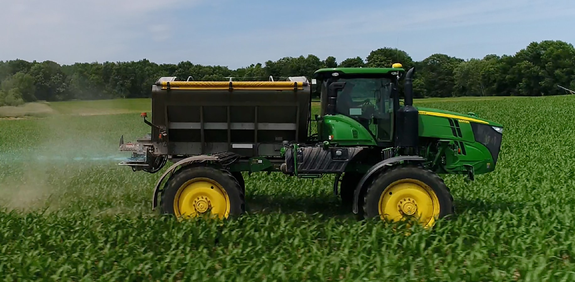 Tractor in corn field.
