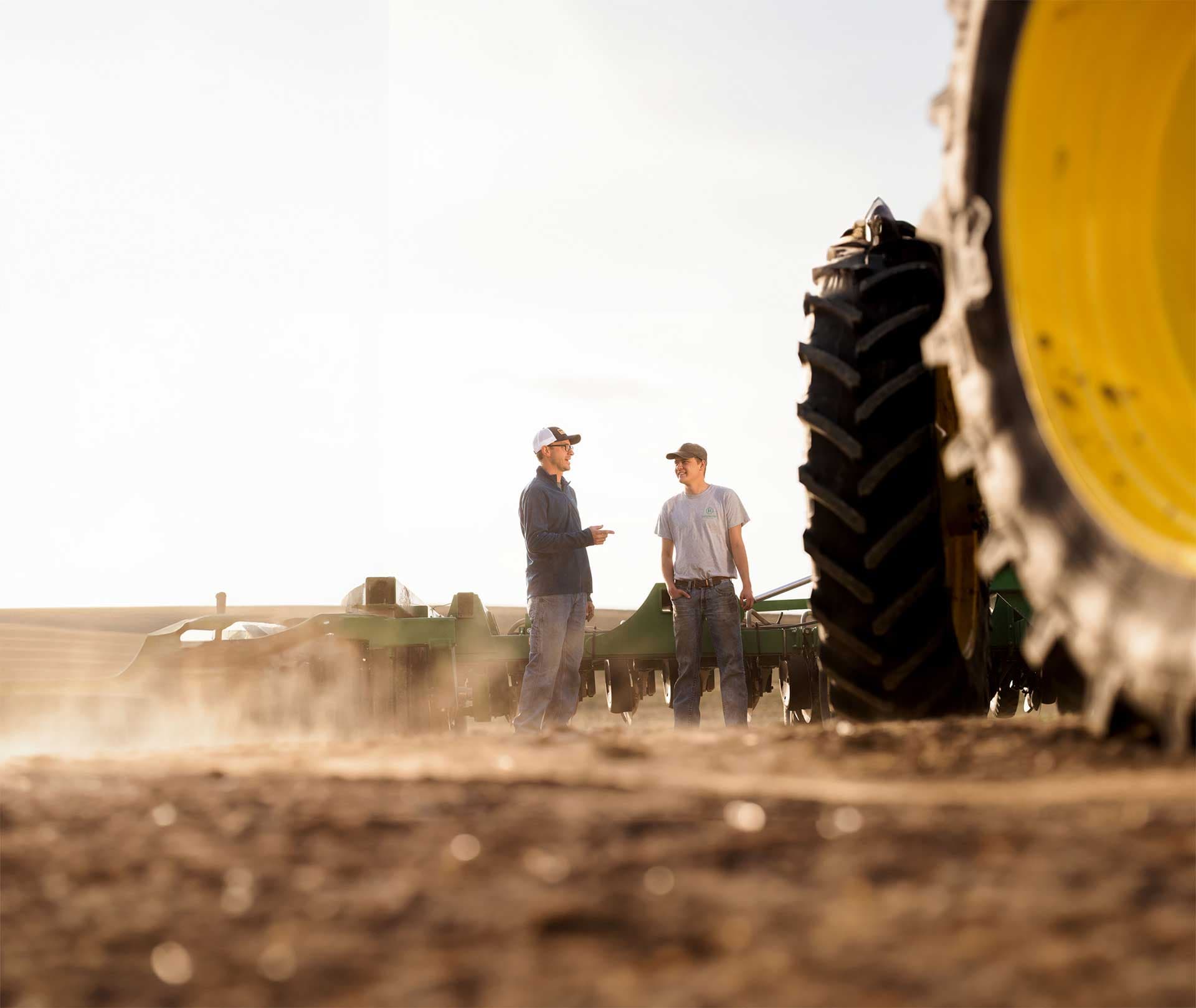 man applying PROTIVATE to a field